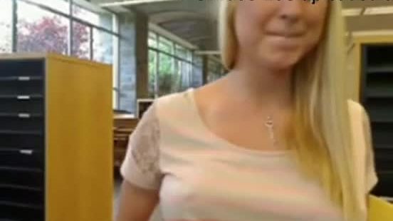 Cute blonde masturbates in Library